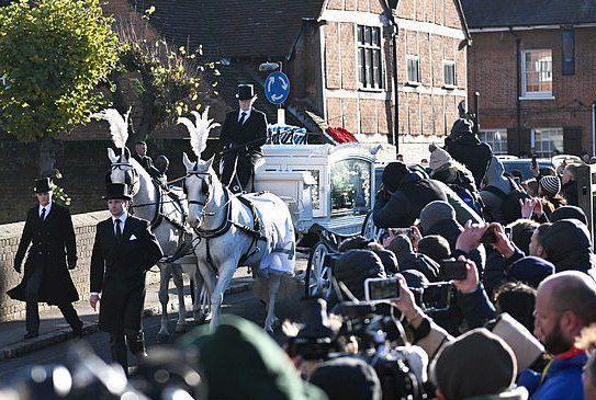 British Pakistani Index via X The press gather for a shot of Liam Payne's funeral.