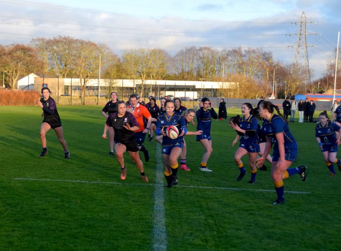 Aberdeen University Women's Ruby Club on the field playing against RGU.