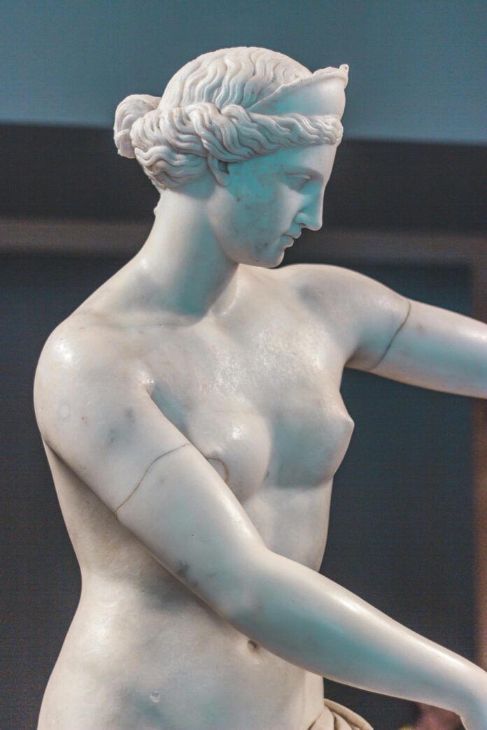 A sculpture of a woman in an art gallery