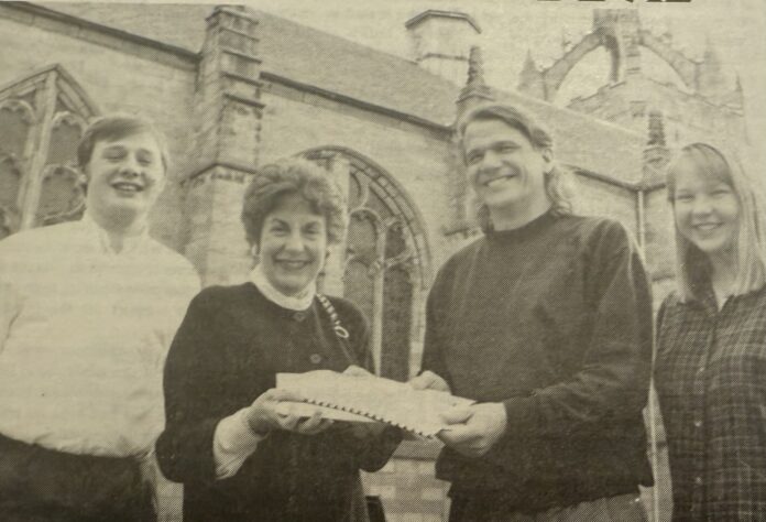 Photo credit (Ron Bird): The Gaudie Archives. Caption: From L-R Richard Baker, Gillian Shephard (then Education Secretary), Ron Bird and Mr. Bird’s successor Louise Adam. Mr. Bird presenting the Education Secretary with a petition signed by 1000 students against cuts to education.