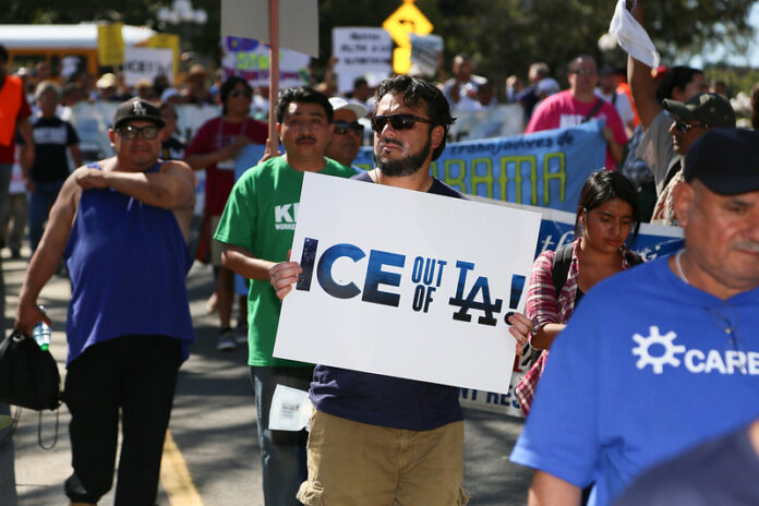 Image of protester. Credit: SEIU Local 99, via Flickr.