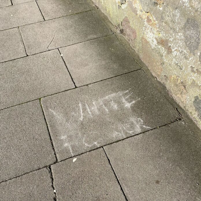 racist graffiti cicture; the words 