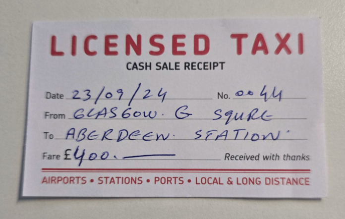 A handwritten UK taxi receipt titled 