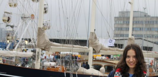 Author Valentina Negrea with the Malcolm Miller schooner at Aberdeen Tall Ships 2025