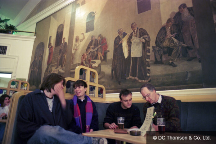 Aberdeen University students enjoy a lunchtime drink under the shadow of Sivell's murals, 1993 (Used by kind permission of DC Thomson & Co Ltd)